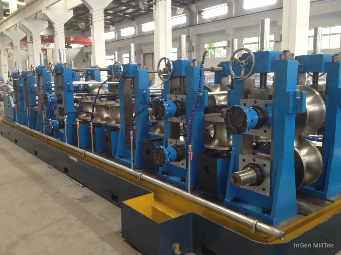 Close-up of forming stands and rollers